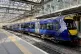 A ScotRail train waiting at the platform at Edinburgh's Waverley Station