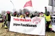 Tesla IG Metall affiliated workers protest on January 11 2025 with a ’Tesla workers against fascism’ banner their faces pixelated by the photographer to prevent identification and repressions by Tesla management / Pic: Shushugah/CC