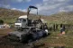 Residents remove a torched tractor that, according to the Palestine Red Crescent, was torched by Israeli settlers, alongside tents and cars in the West Bank village of Tayasir, near Tubas, March 31, 2026
