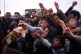 Displaced child scramble for donated food beside the tents they use as shelters after fleeing Israeli bombardment in southern Lebanon, in Beirut, Lebanon, April 9, 2026