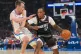 Phoenix Suns guard Jamaree Bouyea (right) pushes past Oklahoma City Thunder forward Payton Sandfort during the first half of an NBA basketball game, in Oklahoma City, April 12, 2026