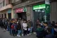 People gather at the entrance of the Pakistani consulate in Barcelona, Spain, January 29, 2026, following the Spanish government's decision to grant residency and work permits to potentially hundreds of thousands of immigrants