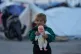 Eliana Abi Nassif, 2, holds a doll next to her family's tent used as a shelter after fleeing Israeli bombardment in Dahiyeh, Beirut's southern suburbs, in Beirut, April 15, 2026