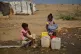 Internally displaced Sudanese children collect water at the Al Heshan camp in Port Sudan, Sudan, April 15, 2026