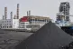 Coal piles sit near a chemical plant in Datong, China, March 14, 2026