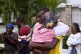 Relatives of a victim of a deadly stampede embrace each other in Milot, Haiti, April 12, 2026