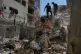 Lebanese civil defense workers inspect the rubble at the site of a building destroyed in an Israeli airstrike a day earlier in Beirut, Lebanon, April 9, 2026