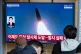 A TV screen shows a file image of North Korea's missile launch during a news program at Seoul Railway Station in Seoul, South Korea, April 8, 2026