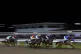Runners and riders on the first lap of The Ministry Of Sound Handicap at Chelmsford City racecourse, February 16, 2023