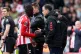 Sunderland manager Regis Le Bris (right) congratulates Brian Brobbey as he is substituted during the Premier League match at the Stadium of Light, Sunderland, April 12, 2026