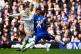 Manchester City's Erling Haaland (left) attempts a shot on goal during the Premier League match at Stamford Bridge, London, April 12, 2026