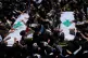 Lebanese Civil Defence members and mourners gather around the coffins of three colleagues killed by an Israeli strike last Tuesday during their funeral procession in the southern port city of Tyre, Lebanon, April 30, 2026