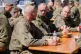 German Chancellor Friedrich Merz talks to soldiers during a lunch on the occasion of his visit to the army at the Bundeswehr base in Munster, Germany, Thursday, April, 30, 2026