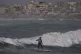 Palestinian Tahseen Abu Assi rides a wave at a beach along the Mediterranean Sea in Gaza City, May 4, 2026