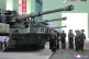 In this photo provided on May 8, 2026, by the North Korean government, its leader Kim Jong Un, center, visits a major munitions factory at an undisclosed location, North Korea, May 6, 2026