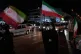 Women hold Iranian flags for a pro-government campaign in downtown Tehran, Iran, May 8, 2026