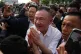 Former Thailand Prime Minister Thaksin Shinawatra (centre) gestures to his supporters following his release on parole from a Bangkok prison in Bangkok, Thailand, May 11, 2026