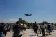 People film a US Air Force Boeing C-17 Globemaster III transport aircraft as it arrives at the Beijing International Capital Airport ahead of US President Donald Trump's visit, in Beijing, May 11, 2026