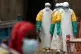 Health workers dressed in protective gear begin their shift at an Ebola treatment center in Beni, Congo, July 16, 2019