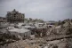 A tent camp for displaced Palestinians stretches among the ruins of buildings destroyed during the Israel Hamas war, in Gaza City, May 15, 2026
