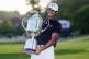 Aaron Rai, of England, holds the Wanamaker Trophy after winning the PGA Championship golf tournament at Aronimink Golf Club, May 17, 2026, in Newtown Square, PA.