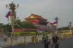 Cyclists pass by Russian and Chinese national flags displayed along the Tiananmen Gate ahead of Russian President Vladimir Putin's two days official visit to and meet with Chinese President Xi Jinping, in Beijing, May 19, 2026