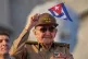 Raul Castro waves a Cuban national flag during a May Day parade at Revolution Square in Havana on May 1, 2025