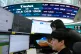 Currency traders watch monitors at the foreign exchange dealing room of the Hana Bank headquarters in Seoul, South Korea, May 20, 2026