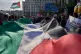 Demonstrators wave a giant Palestinian flag outside Greece's Foreign Ministry in Athens, April 30, 2026, during a rally to protest the interception of Gaza aid ships by Israeli forces near Greek waters