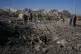 Palestinians inspect the site of an Israeli strike in Khan Younis, southern Gaza Strip, May 29, 2026