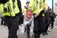 A Palestine Action demonstrator is hauled off by police