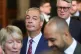 Reform UK leader Nigel Farage walks through the Member's Lobby of the Houses of Parliament in London to the House of Lords to hear the King's Speech during the State Opening of Parliament, May 13, 2026