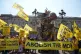 People, along with a fifteen-foot dinosaur mascot Chuck the Rexi, take part in a march by anti-monarchy pressure group Republic, from Trafalgar Square to Buckingham Palace in central London, May 9, 2026