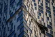 Debris dangles from a damaged apartment building on Mosfilmovskaya street after a Ukrainian drone attack in Moscow, May 4, 2026