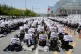 Members of the Samsung Electronics labor union hold up their cards during a rally demanding higher bonuses at its computer chip complex in Pyeongtaek, South Korea, on April 23, 2026. The letters read 