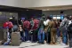 Ghanaian nationals queue with their luggage at O.R. Tambo International Airport as they prepare to board a repatriation flight home following unrest concerns in Johannesburg, South Africa, May 27, 2026