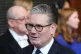 Prime Minister Keir Starmer walks through the Member's Lobby of the Houses of Parliament in London to the House of Lords to hear the King's Speech during the State Opening of Parliament, May 13, 2026