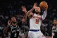 New York Knicks guard Jalen Brunson (11) shoots past San Antonio Spurs guard Stephon Castle during first half of Game 4 of the NBA Finals basketball series, June 10, 2026, in New York