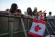 Fans hold Canadian flags while dancing to music before a countdown concert ahead of the World Cup soccer tournament, June 10, 2026, in Toronto