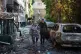 A man helps an elderly woman to evacuate from a residential house damaged after a Russian strike on Kyiv, Ukraine, June 15, 2026