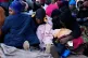People sit on a driveway ahead of their deportation to Malawia at a temporary centre in Durban, South Africa, June 19, 2026