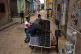 People prepare solar panels set up on the street to charge batteries during a power outage in Old Havana, Cuba, June 19, 2026