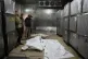 Mourners take the last look at the bodies of two Palestinian girls — Zeina Safadi and her sister Lana, who were killed by an Israeli air strike on their home — during their funeral in Gaza city, June 20, 2026
