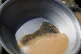 A pan containing gold-bearing sediment and heavy mineral concentrate sits at an artisanal mining site in Dalago Mahas, Sudan's Northern State, May 8, 2026