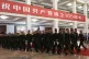 Military personnel march past a banner which reads ‘Celebrating the 105th anniversary of the founding of the Communist Party of China’ at the Great Hall of the People in Beijing, July 1, 2026