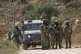 Israeli army units block the road and prevent Palestinian villagers, supported by foreign and Israeli peace activists, from reaching their lands where Israeli settlers established a new outpost, at the occupied West Bank town of Qabalan, Nablus, July 4, 2026