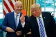 President Donald Trump holds up a red card during a meeting with FIFA president Gianni Infantino in the Oval Office of the White House, Tuesday, Aug. 28, 2018, in Washington