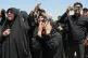 Women react as the coffin of the late Iranian Supreme Leader Ayatollah Ali Khamenei arrives at Hasheminejad International Airport from Iraq for the final stage of his dayslong funeral ceremonies in Mashhad, northeastern Iran, July 9, 2026