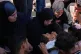 Palestinian women mourn over the body of 10-year-old Motaz Abu Shaar, who was killed by Israeli fire, during his funeral at Nasser Hospital in Khan Younis, southern Gaza Strip, July 14, 2026