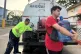 ryan Pérez hauls a five-gallon water jug to his apartment in the Villa Kennedy public housing complex in San Juan, Puerto Rico